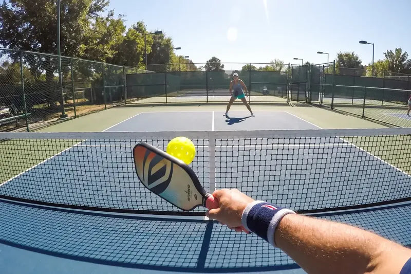 A pickleball rally seen from the player's eyes